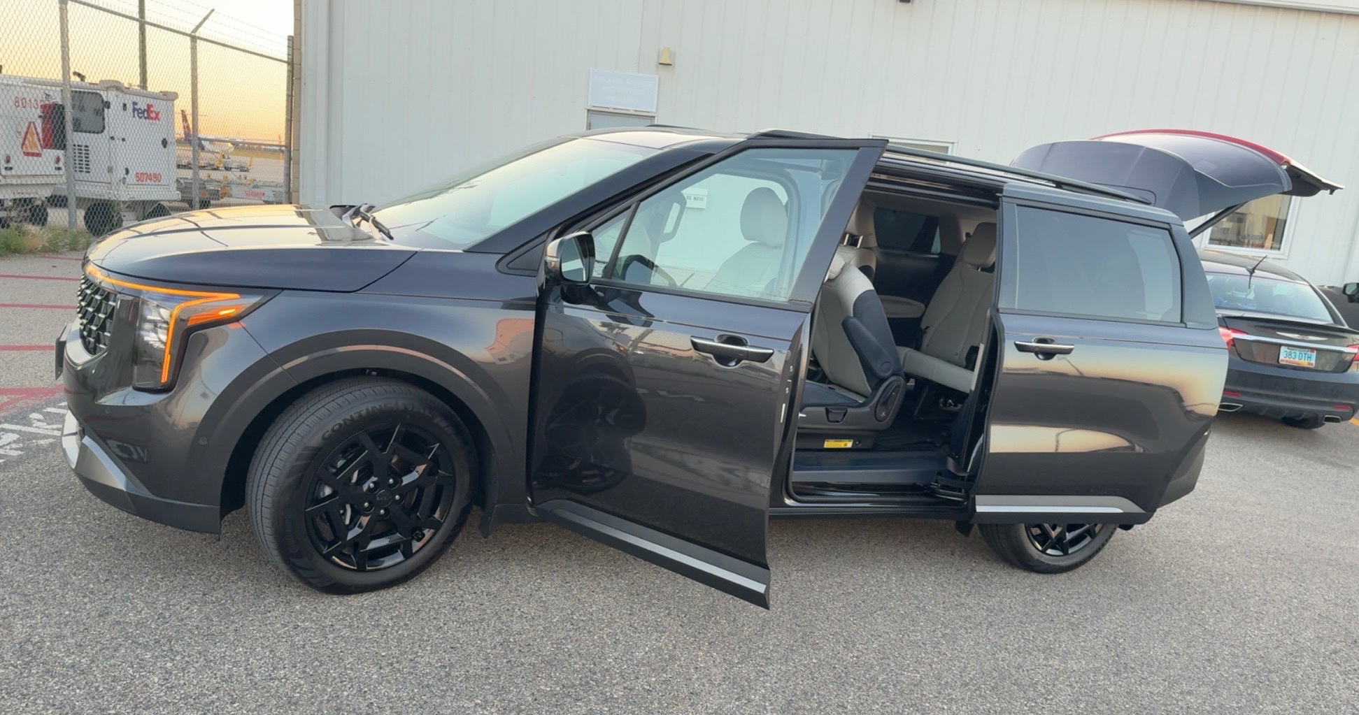 Ellis Transit executive minivan at airport at sunset